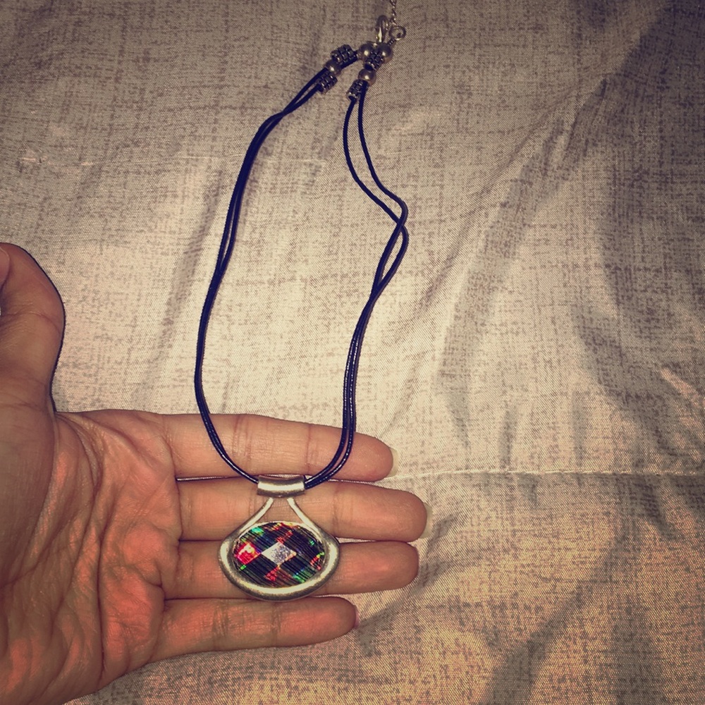 Shiny silver pendent necklace with leather lace